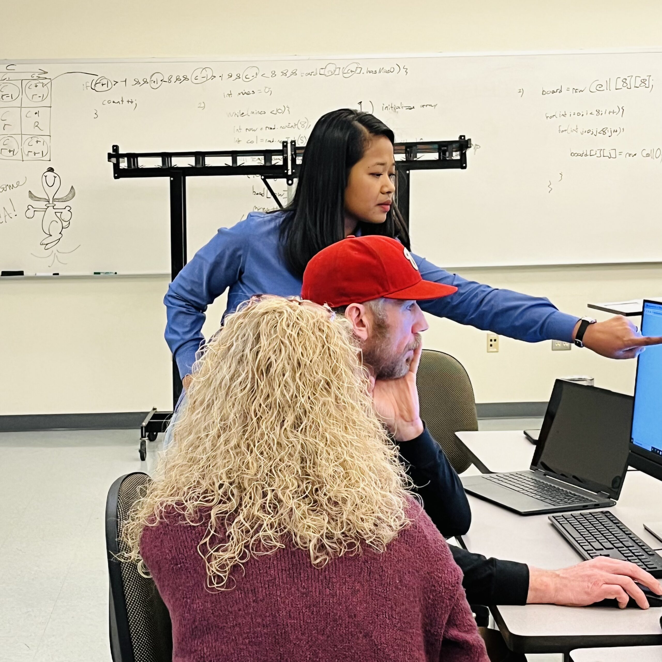 UNCA staff assists a family at 2024 FAFSA Day event