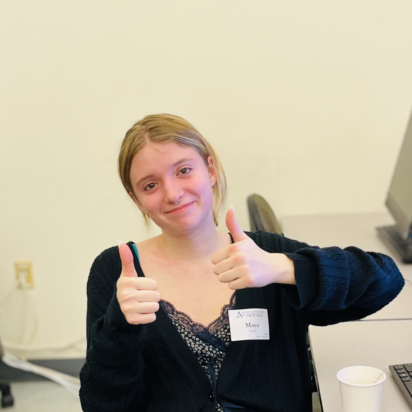 Student giving two thumbs up at UNCA's 2024 FAFSA Day event